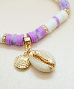 Perlen-Armband mit goldener Kaurimuschel und bunten Katsuki-Perlen.